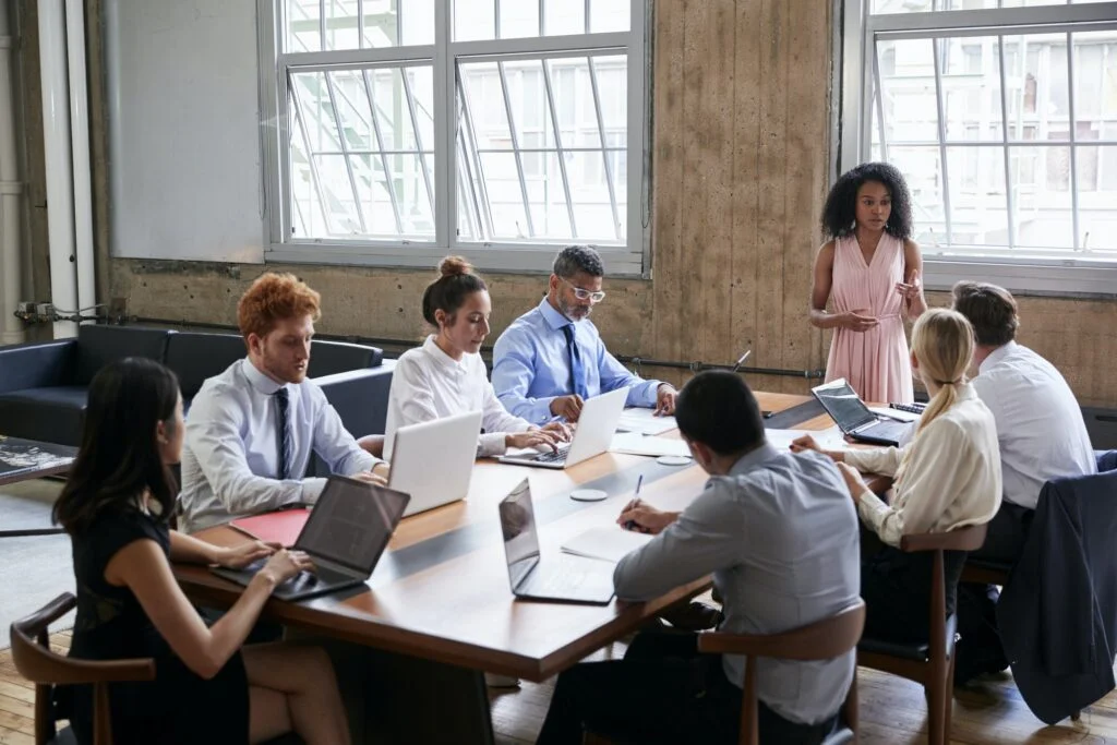 Black businesswoman addressing colleagues at a board meeting